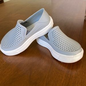 Gray and white Citilane Roka Crocs slip on toddler shoes